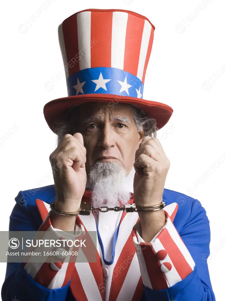 Man in Uncle Sam's costume as prisoner, studio shot