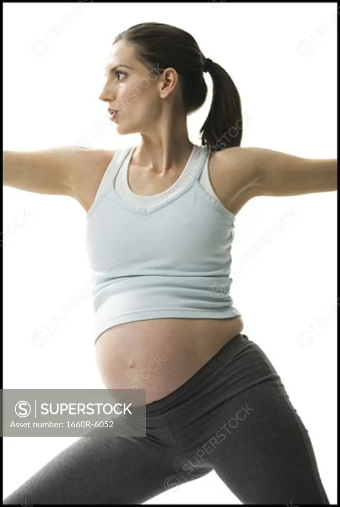 Portrait of a pregnant woman exercising