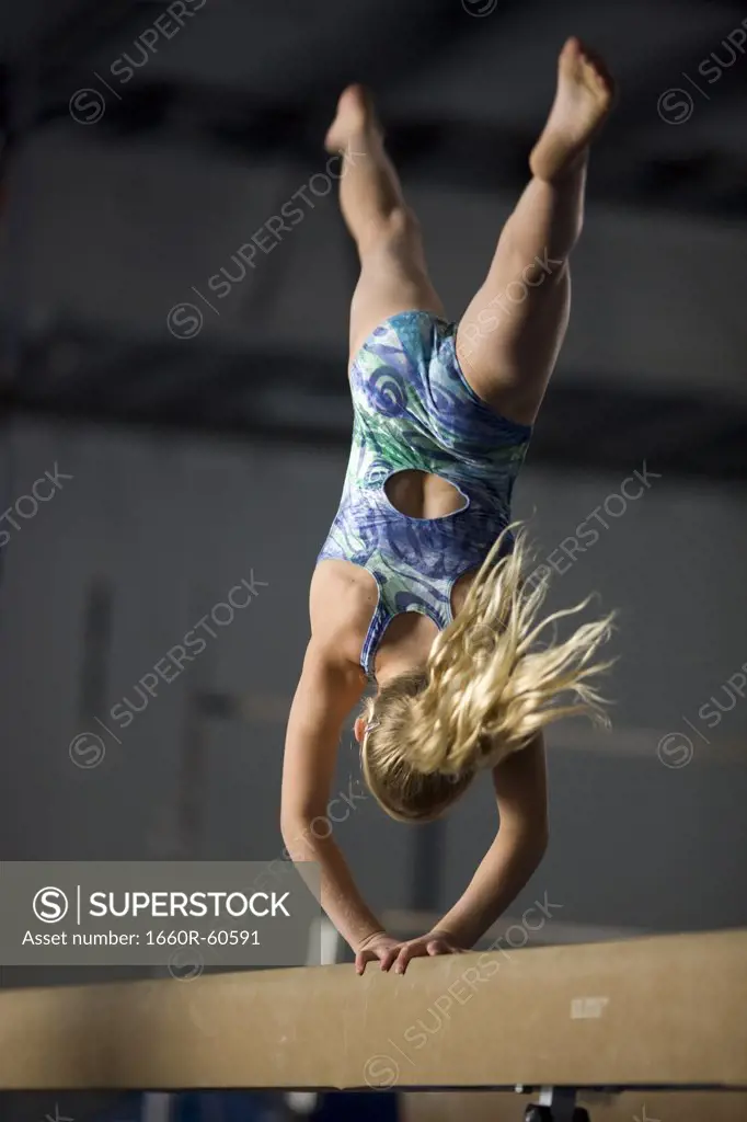 USA, Utah, Orem, girl (10-11) exercising on balance beam