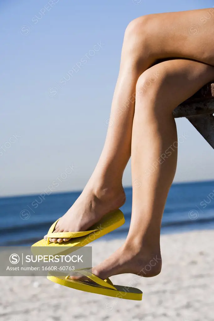 Women's feet in flip flops