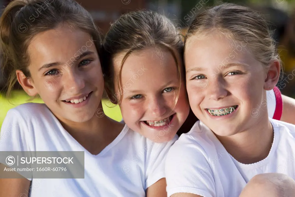 Three girls smiling