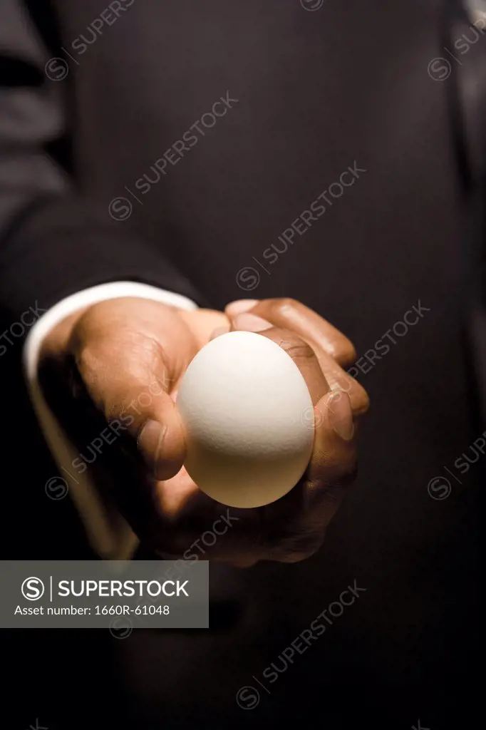 Man with egg in hands