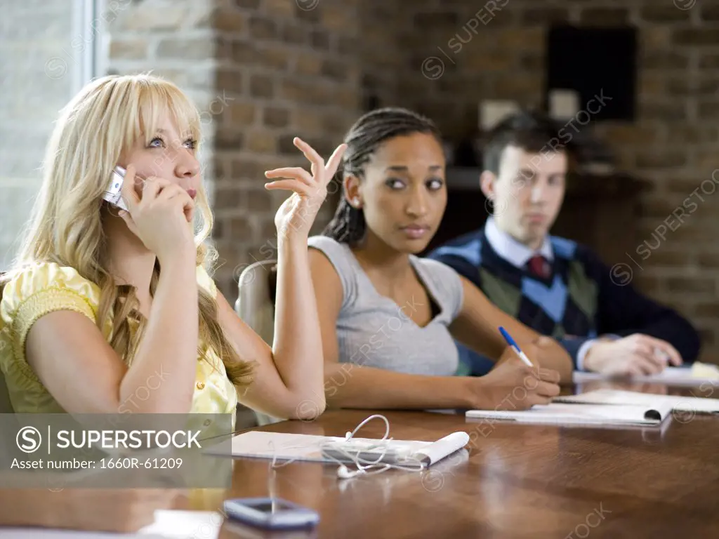 woman on her cell phone during a meeting
