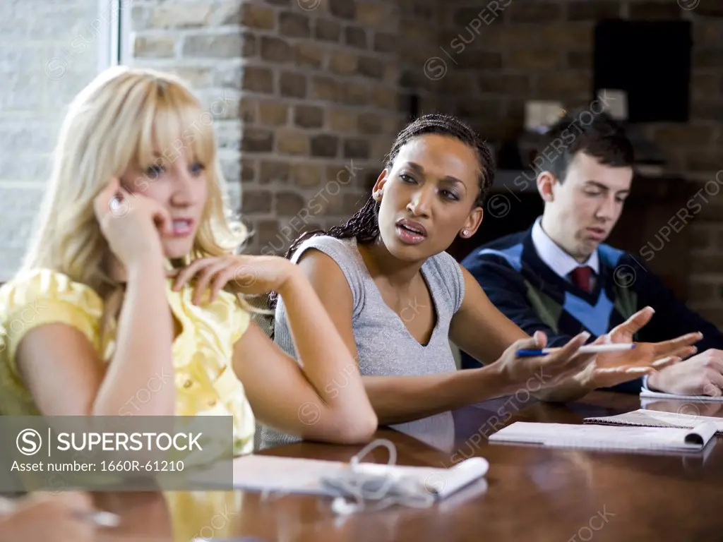 woman on her cell phone during a meeting