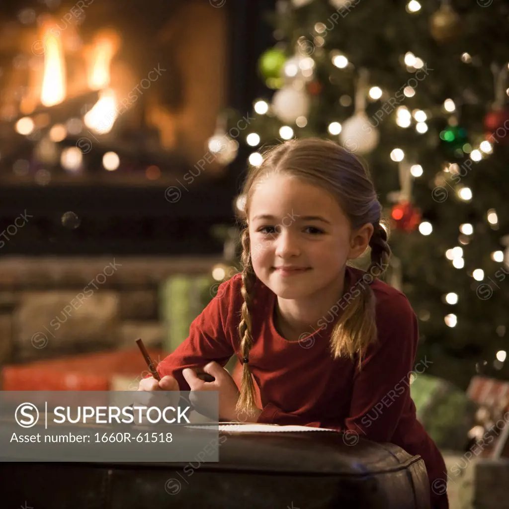 girl writing a letter to santa claus