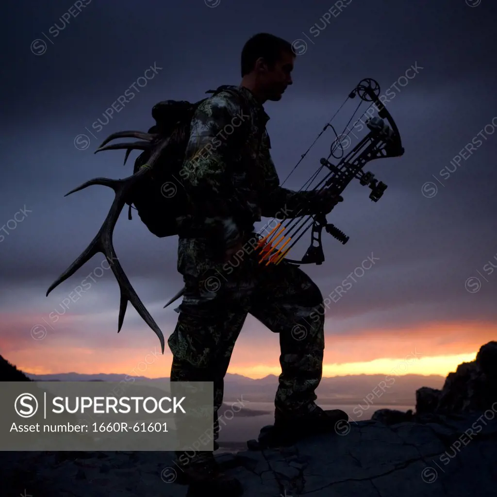 hunter against a sunset