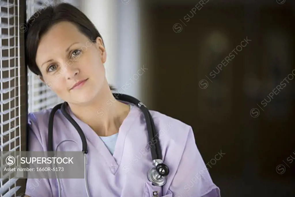 Close-up of a female nurse with stethoscope around her neck
