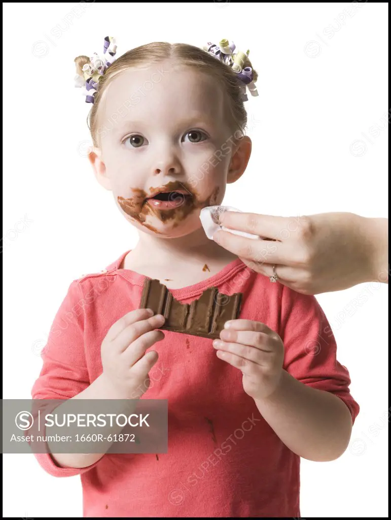 child eating chocolate