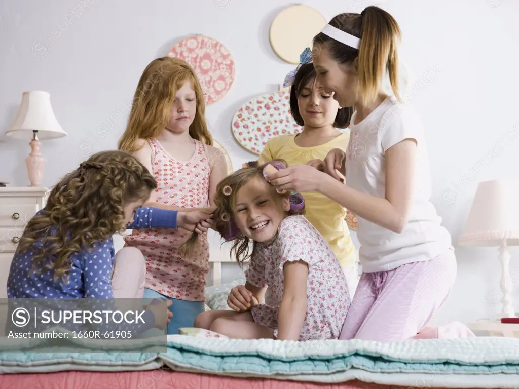 five girls on a bed