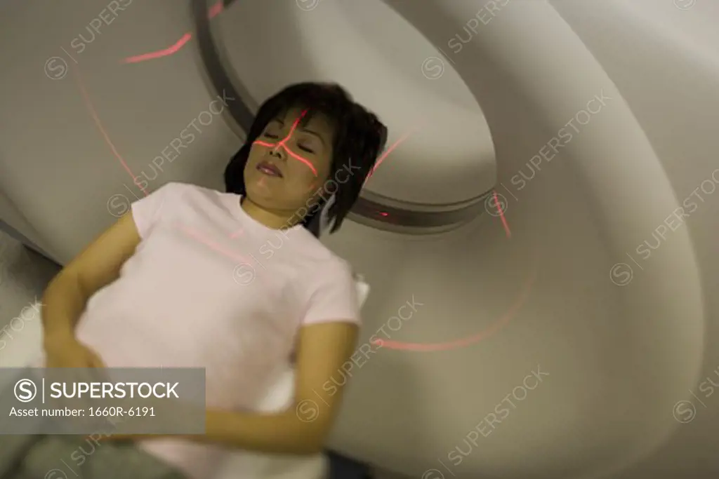 High angle view of a female patient getting an CAT scan