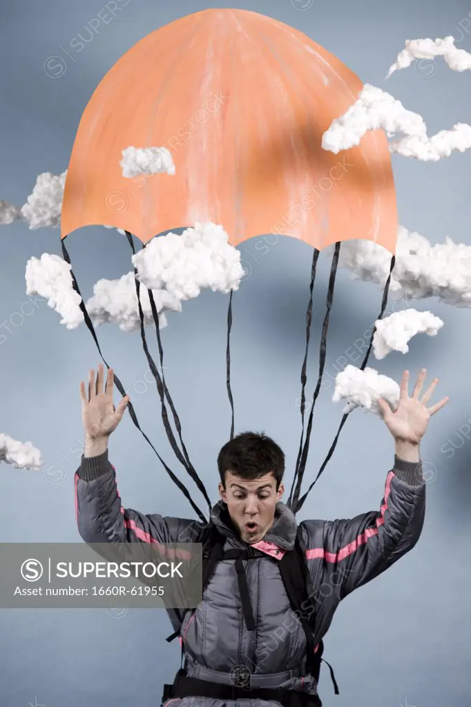 man in a jumpsuit parachuting