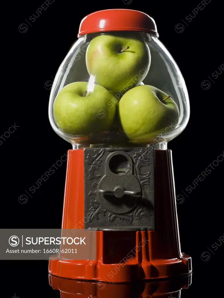 green apples in a gumball machine