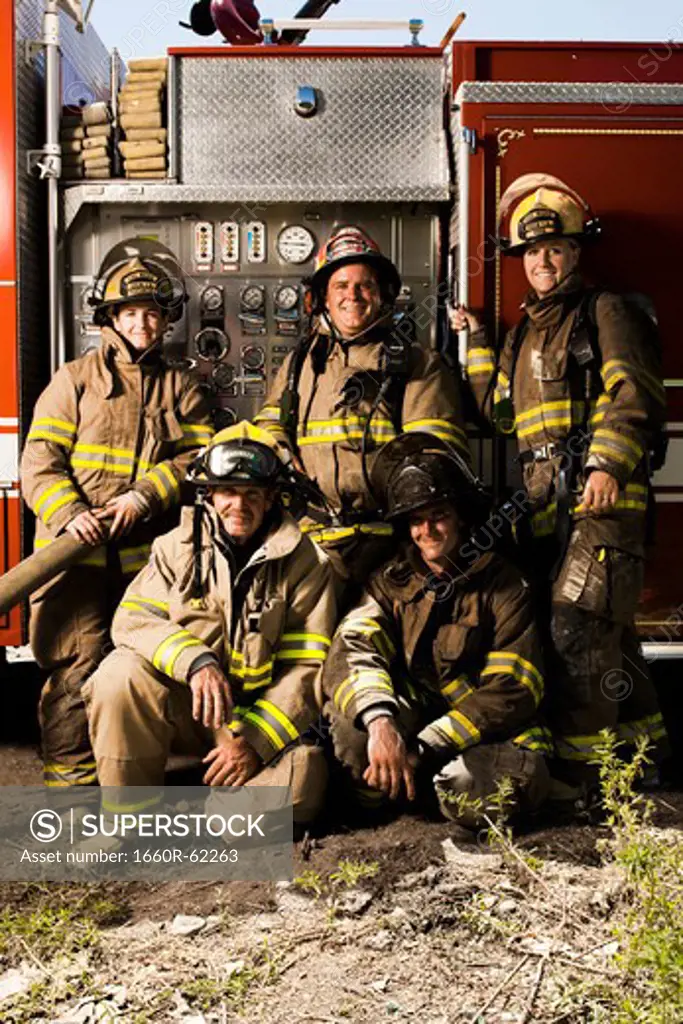 Group portrait of firefighters and fire engine