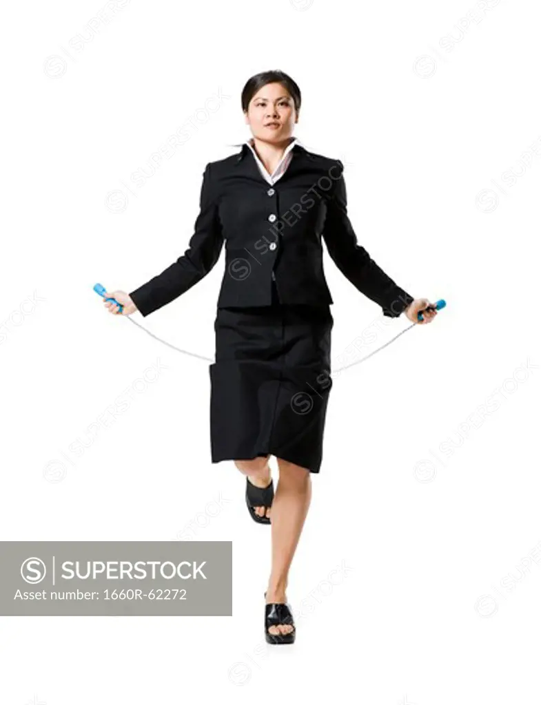 Woman standing with skipping rope