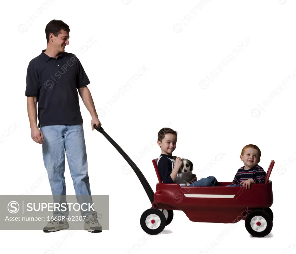Father with sons and toy wagon