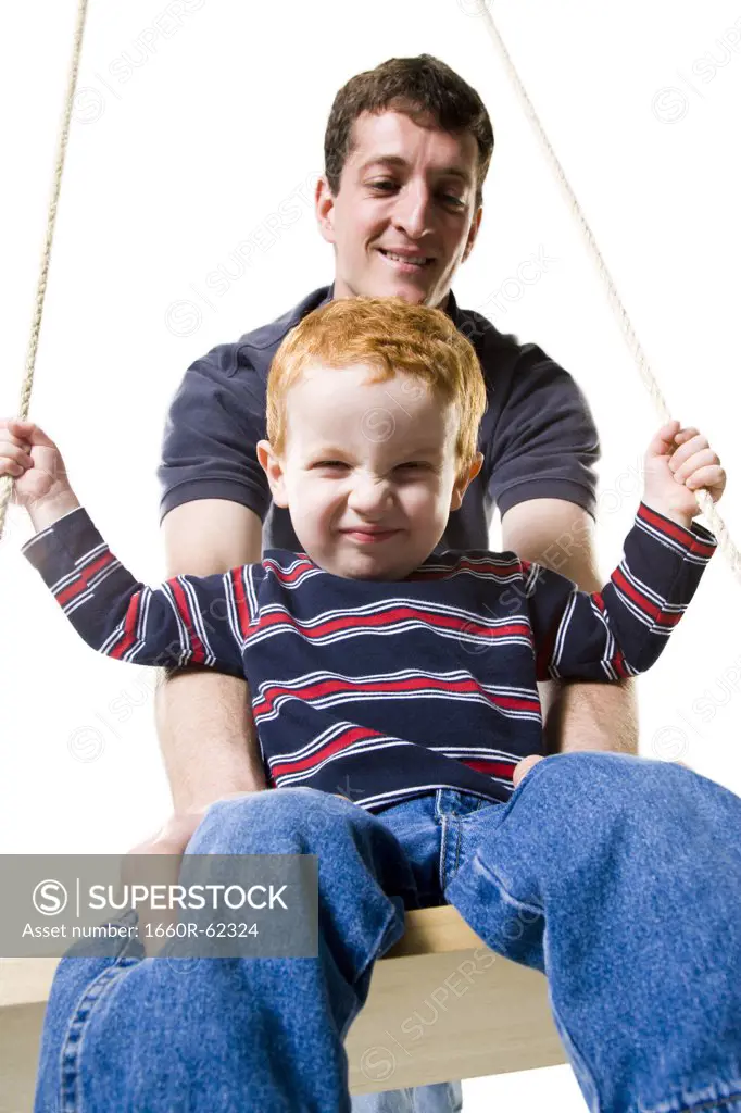 Father with son on swing