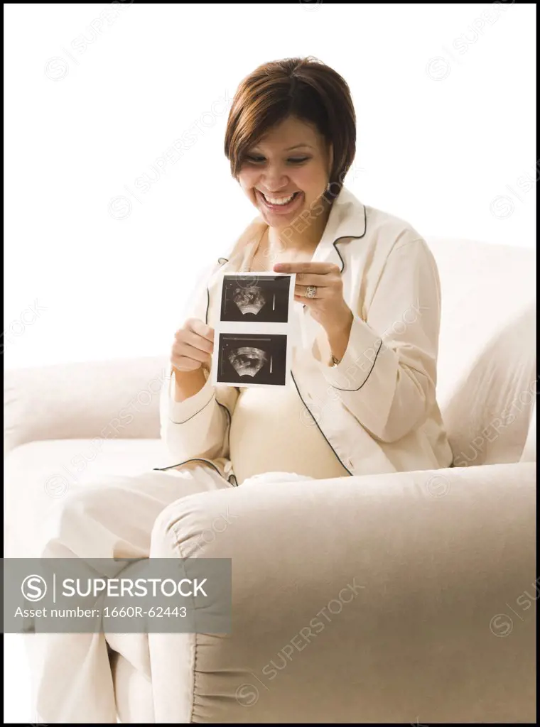 Expecting mother talking on cellphone
