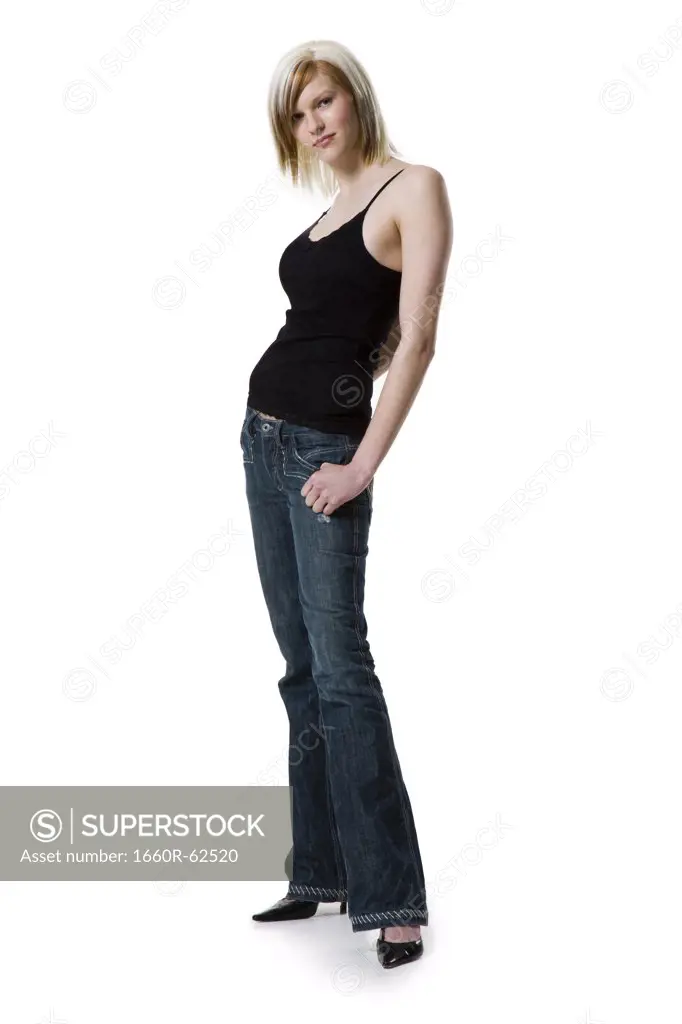 Woman standing with hand on pocket