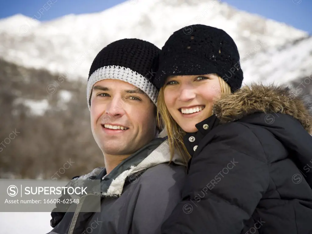 Couple on snow mobile
