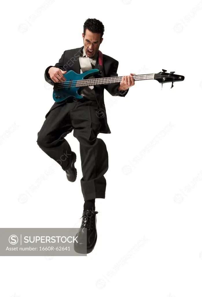 Man jumping with electric guitar