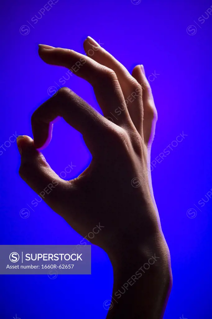 Hand making okay gesture