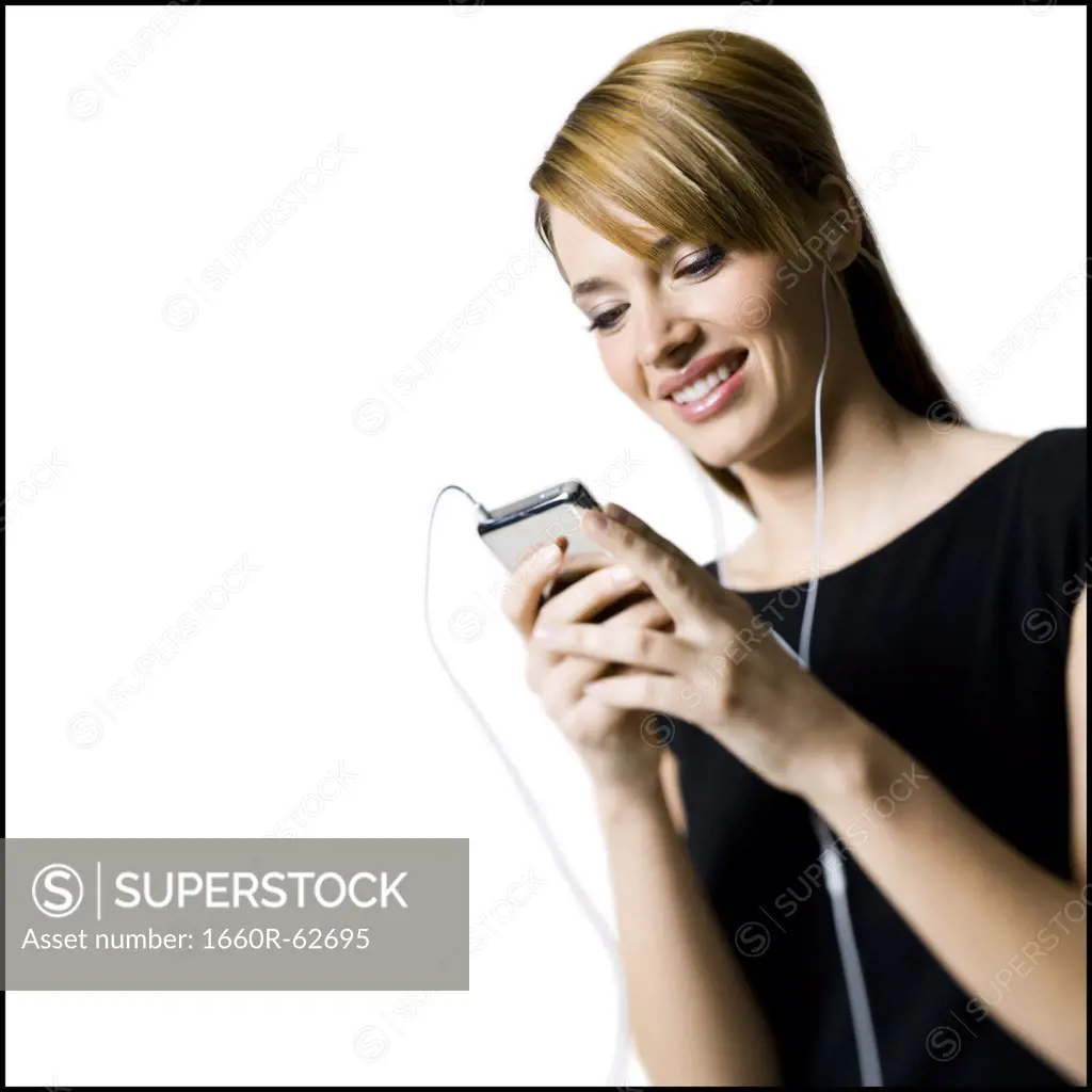 Woman with listening device and earbuds