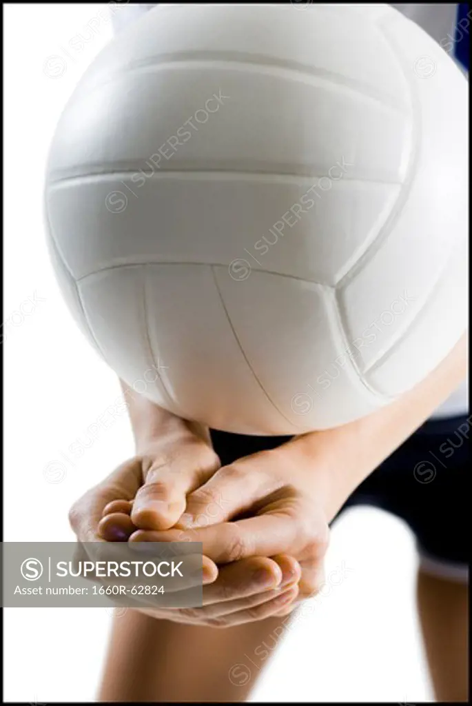 Volleyball player serving ball
