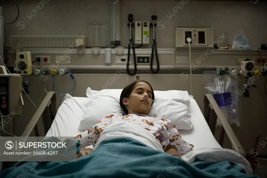 High angle view of a female patient sleeping on a hospital bed