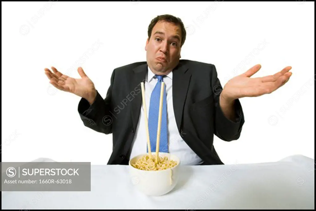 Businessmen eating noodles