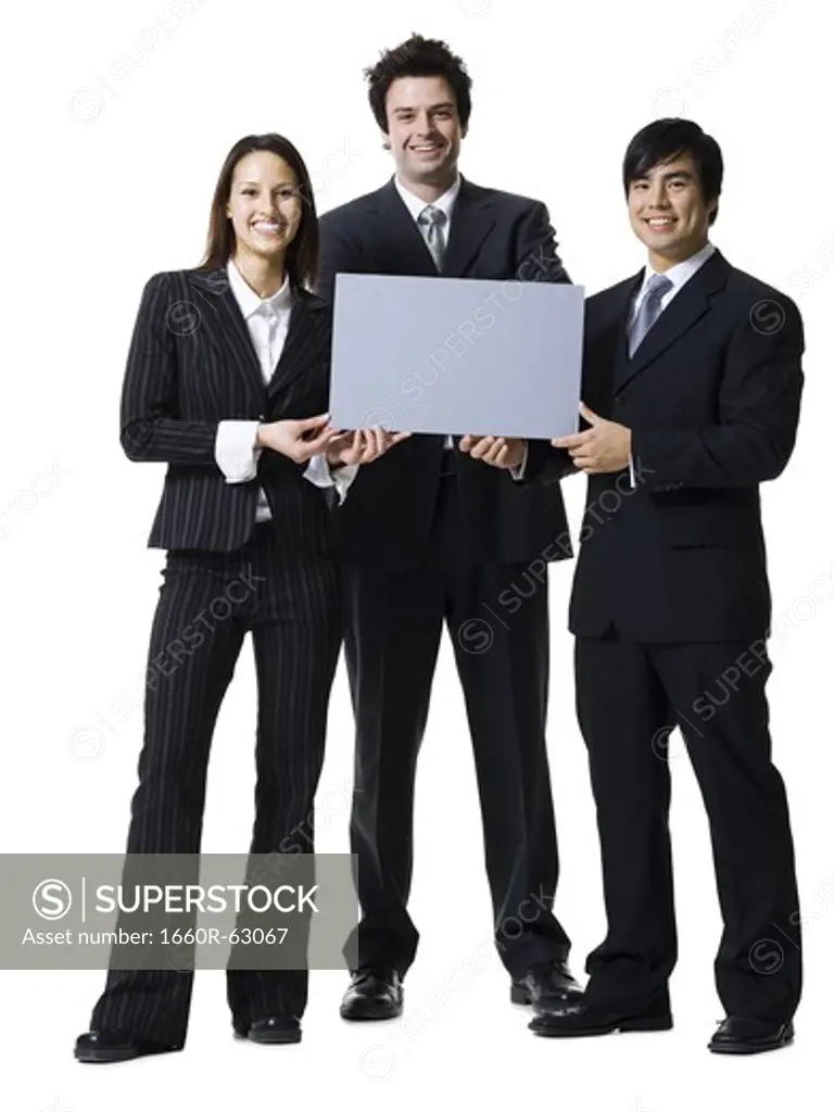 Three business people holding a blank sign