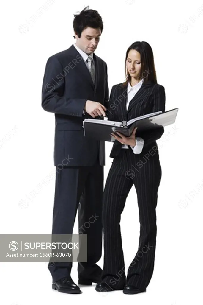 Businessman and businesswoman reviewing documents