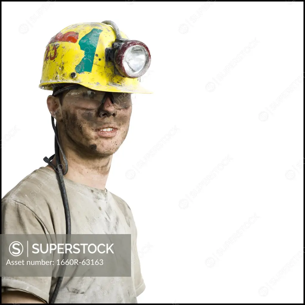 Miner with flashlight helmet