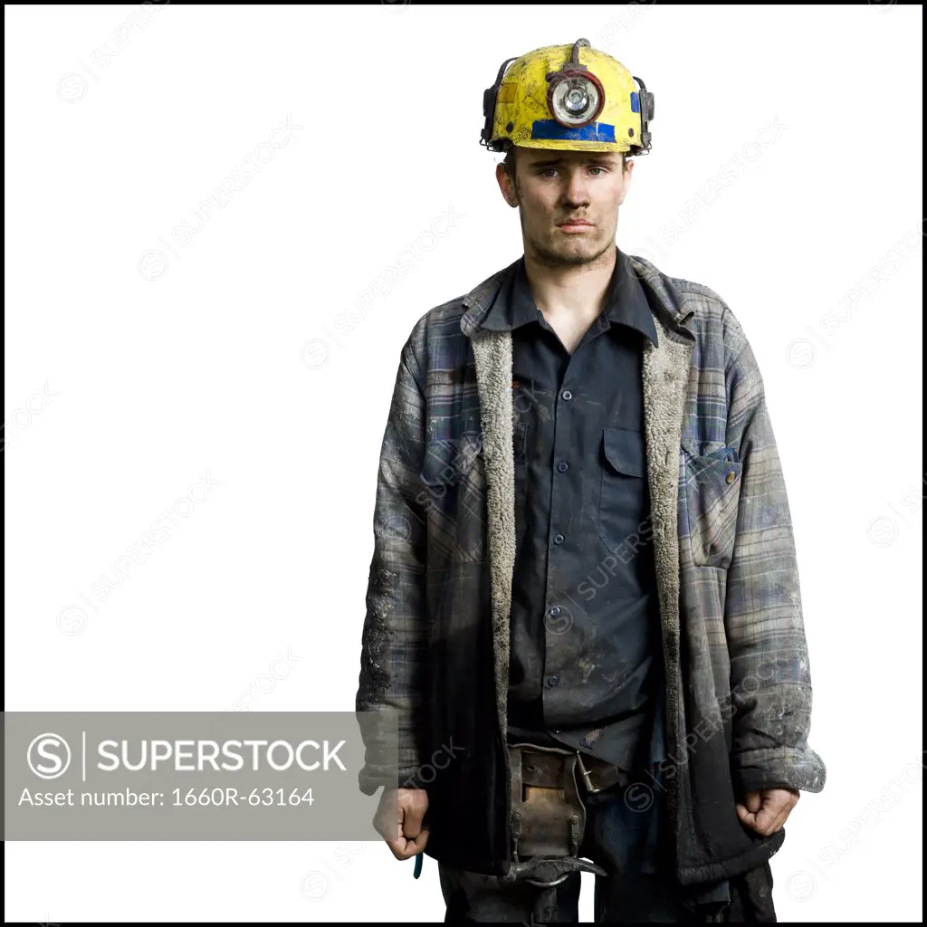 Miner with flashlight helmet