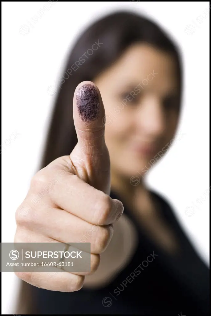 Woman displaying thumb with ink stain