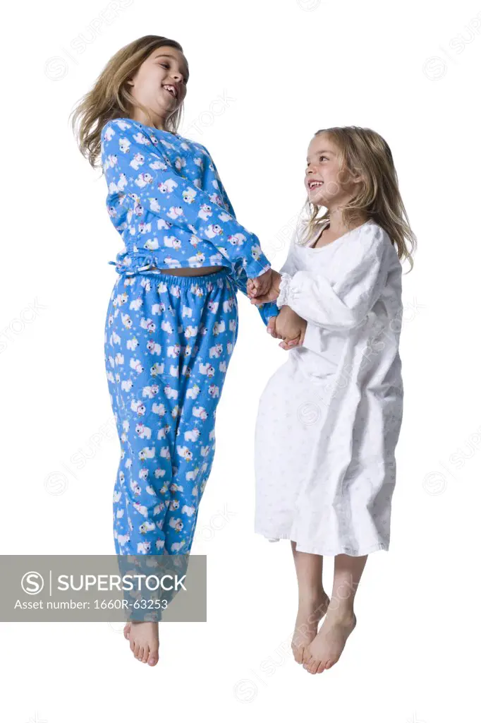 Young sisters in pajamas