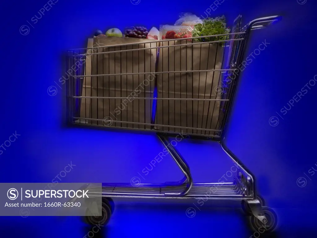 Close-up of a shopping cart with groceries