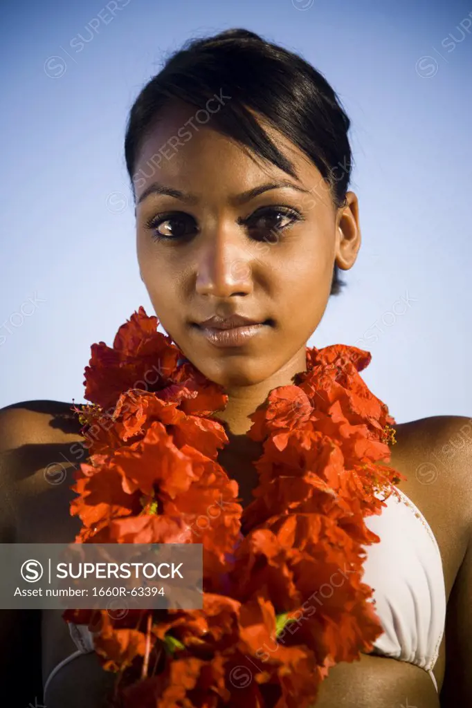 African-American woman with a red lei