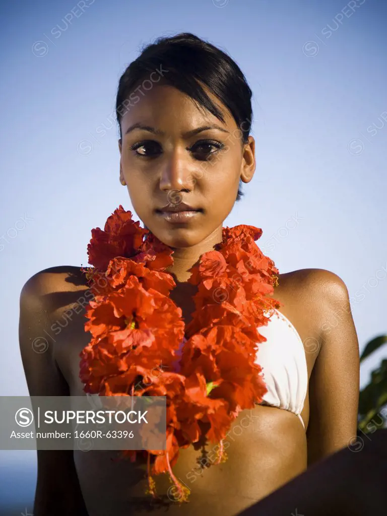 African-American woman with a red lei