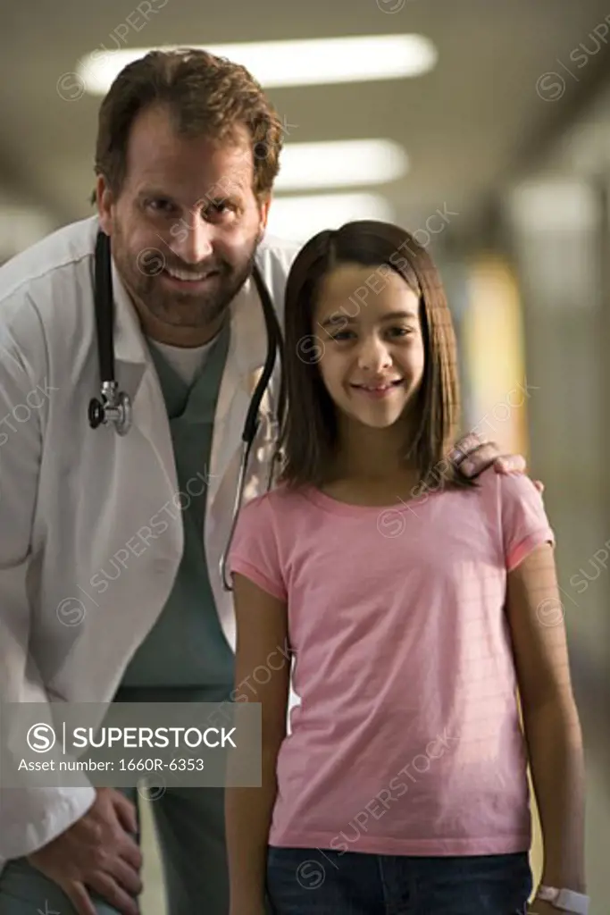 Portrait of a girl standing with a male doctor