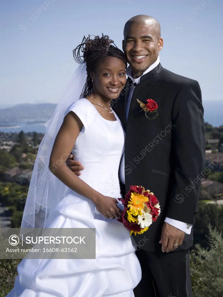 Portrait of a newlywed couple smiling together