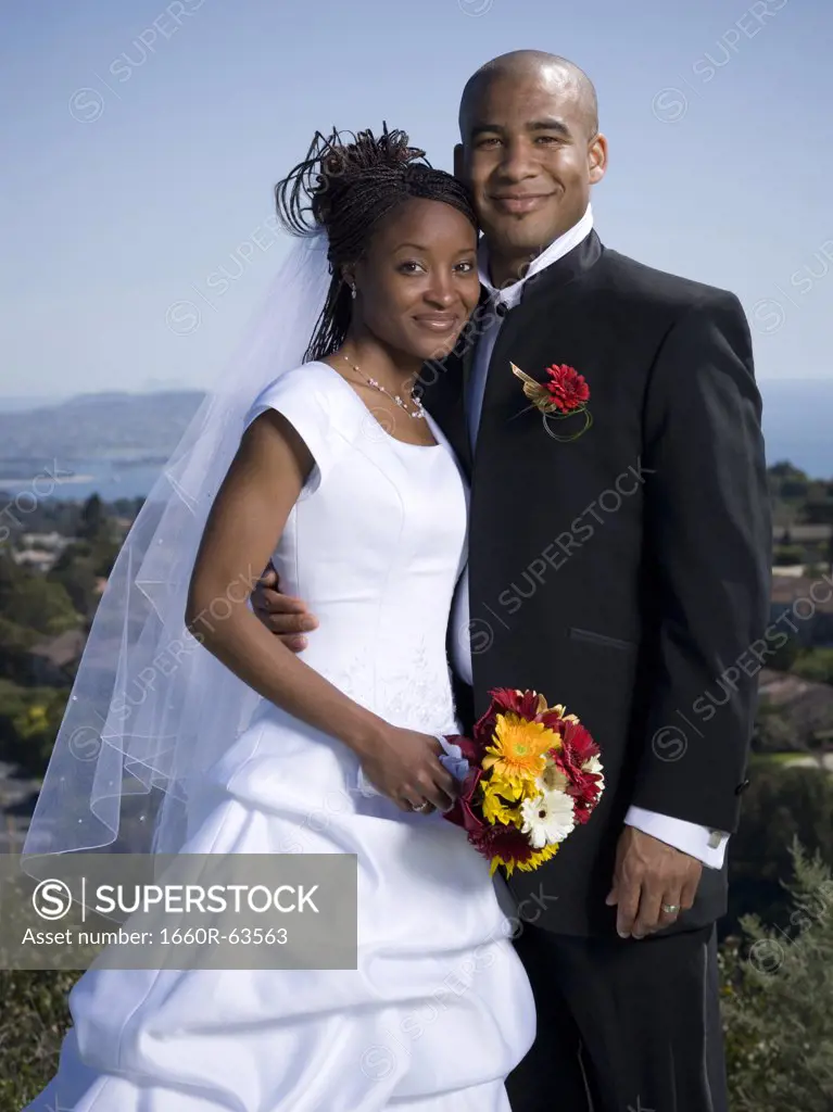 Portrait of a newlywed couple smiling together