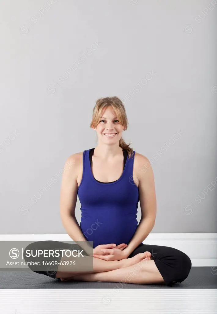 Portrait of young of pregnant woman, studio shot