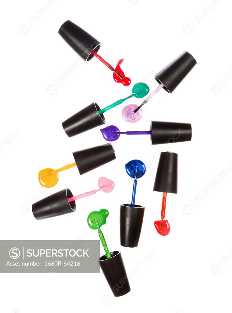 Colorful paintbrushes on white background forming abstract pattern