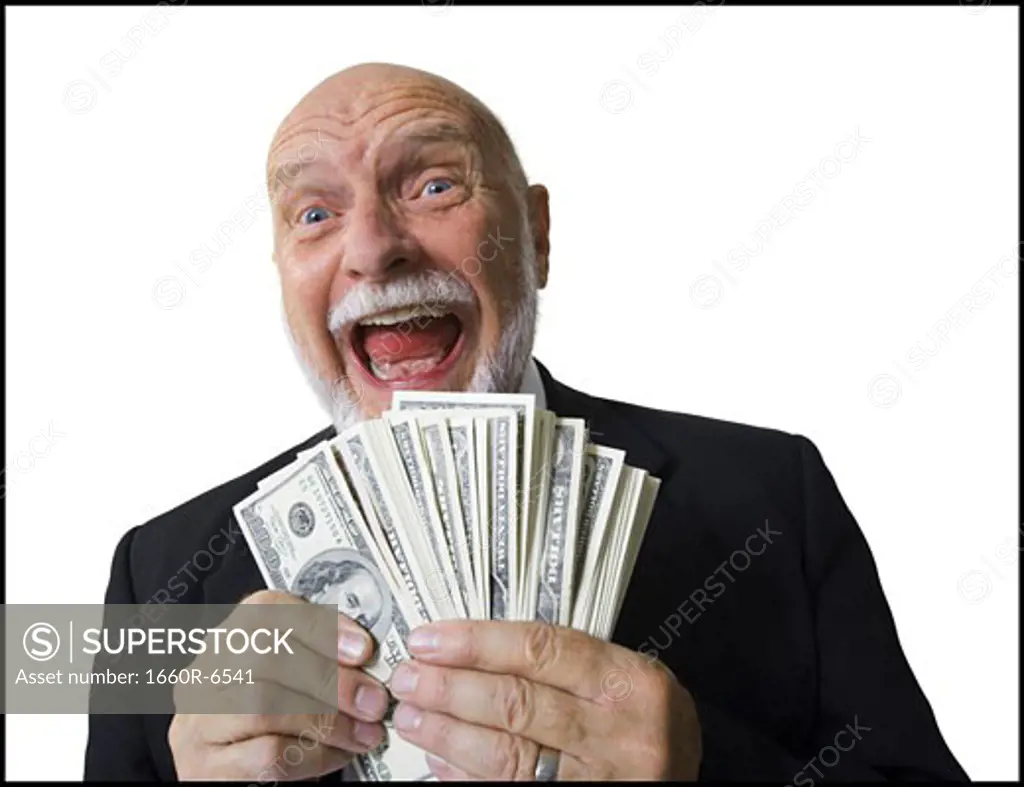 Portrait of a businessman holding American dollar bills