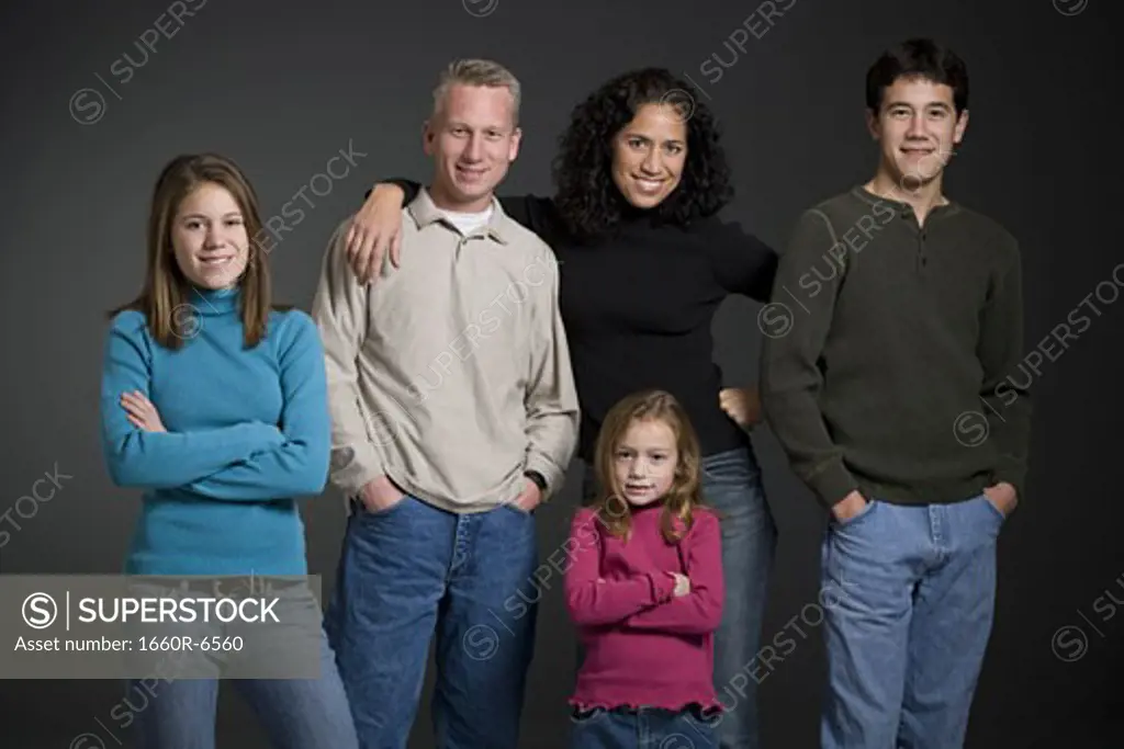 Portrait of a family: mother, father and three siblings