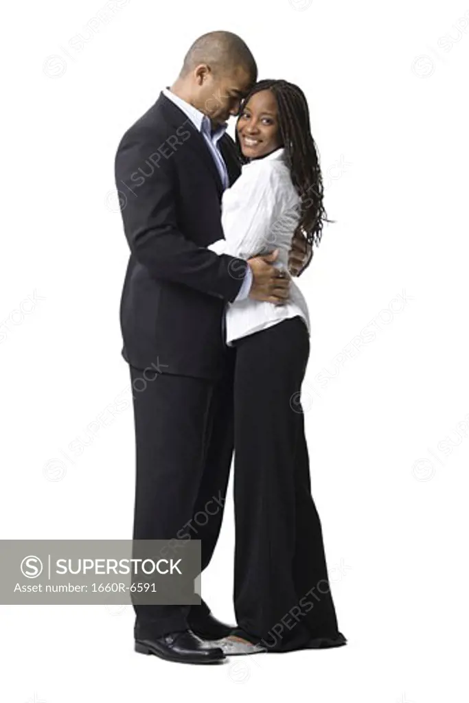 Profile of a young couple embracing each other