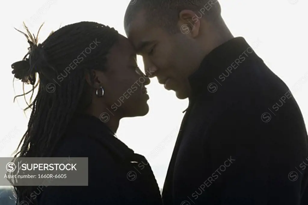 Profile of a young couple looking at each other