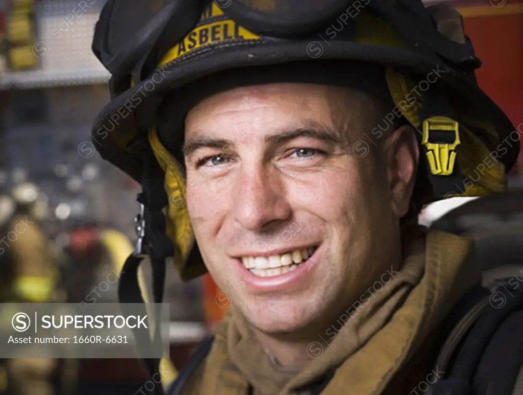 Close-up of a firefighter wearing a helmet