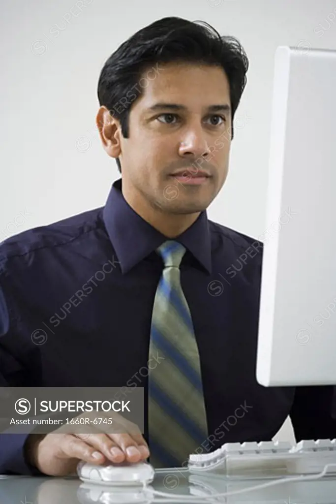 Close-up of a mature man using a computer