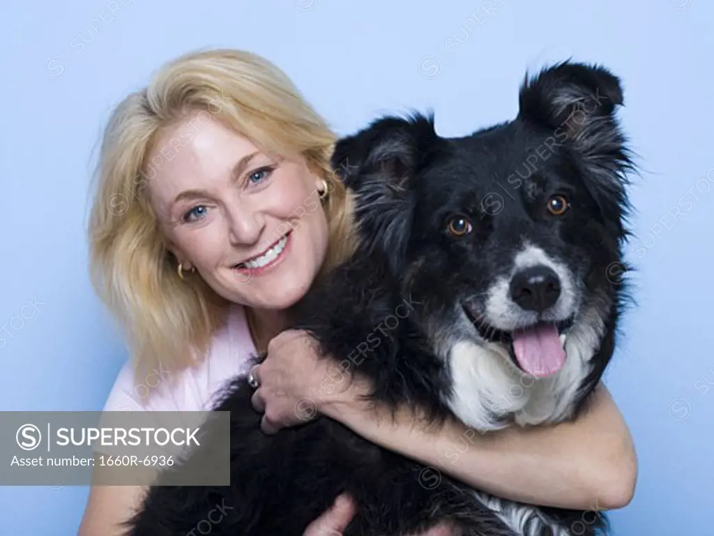 Portrait of a mid adult woman with her dog